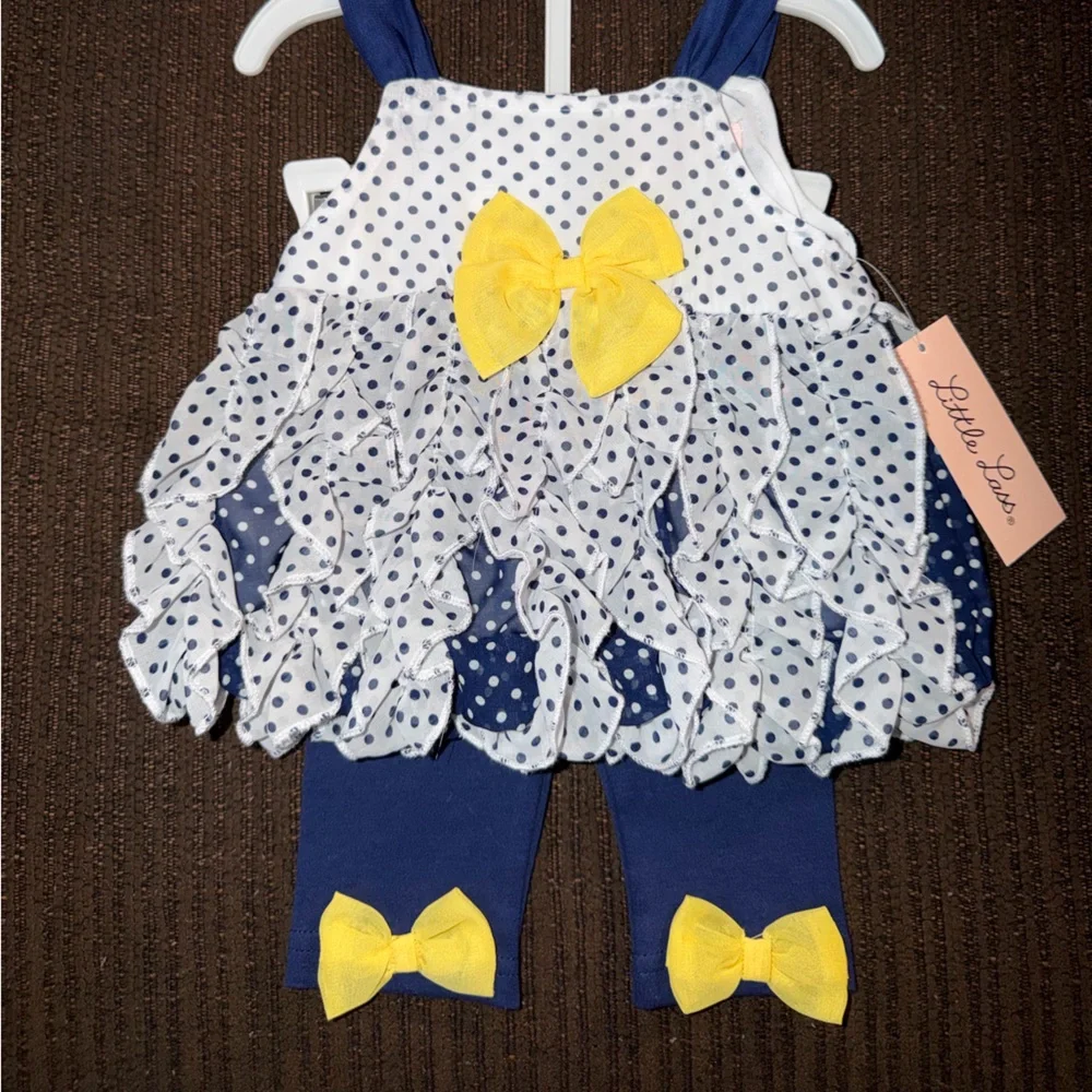 Little Lass Navy and White Polka Dot Bib with Yellow Bow